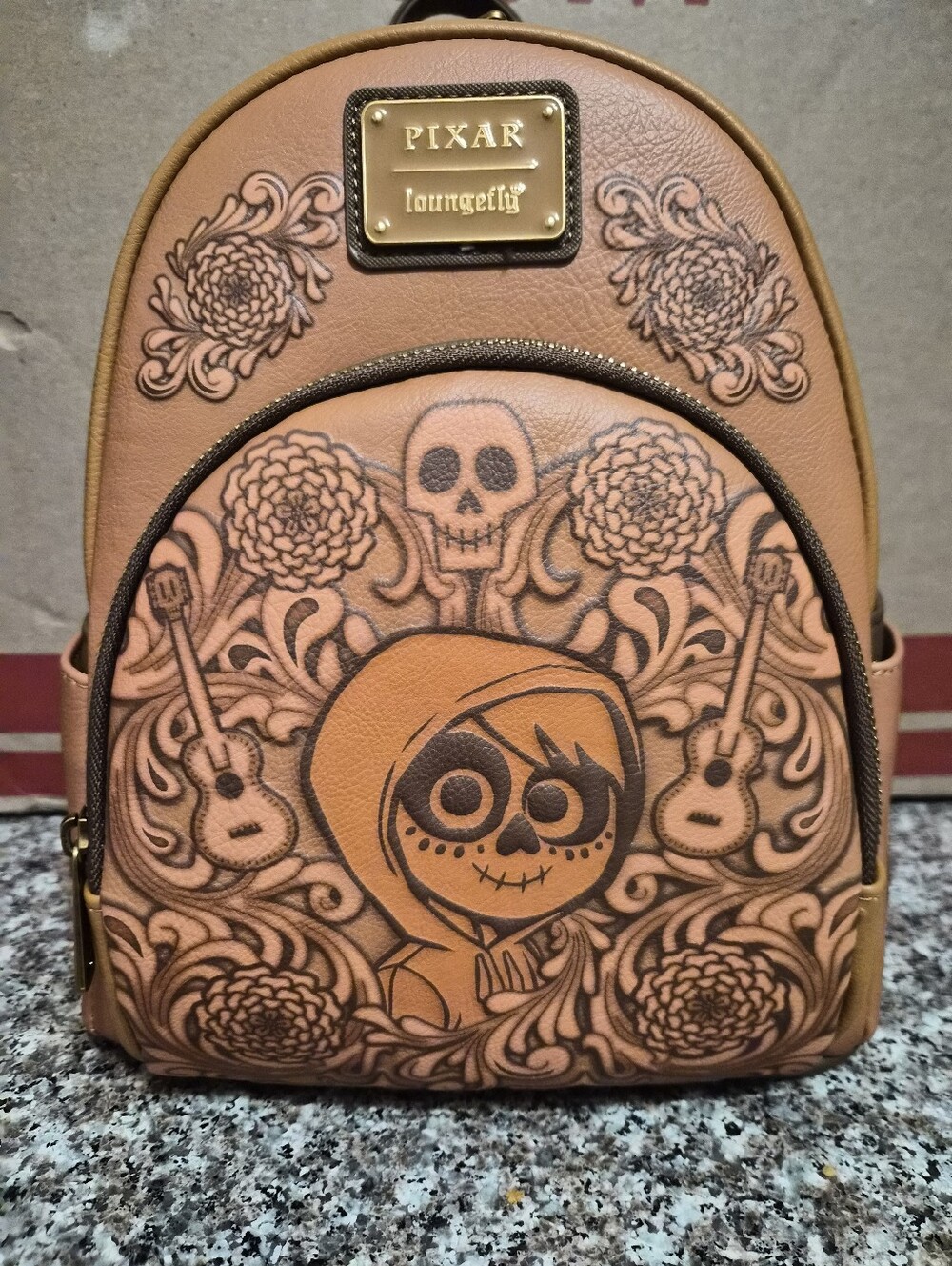Loungefly Pixar Coco-inspired Brown Mini Backpack with Floral Skull Art